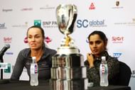 SINGAPORE - NOVEMBER 01:  Martina Hingis of Switzerland and Sania Mirza of India speak at a press conference with the Martina Navratilova Doubles Trophy after defeating Carla Suarez Navarro and Garbine Muguruza of Spain in the doubles final match during the BNP Paribas WTA Finals at Singapore Sports Hub on November 1, 2015 in Singapore.  (Photo by Clive Brunskill/Getty Images)